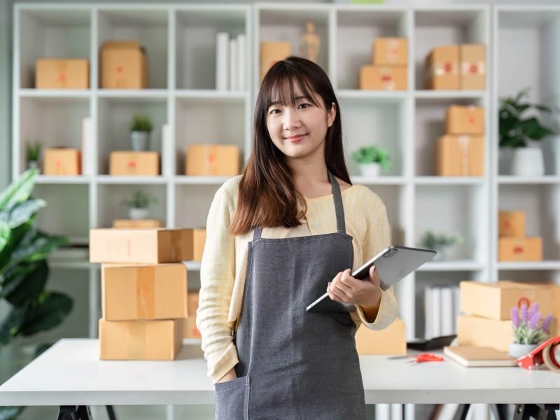 portrait-of-a-young-woman-entrepreneur-in-her-home-office-with-shipping-boxes-and-digital-tablet.jpg